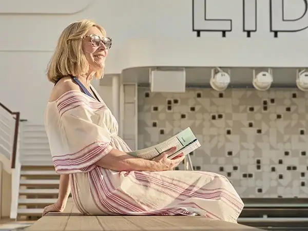 Solo traveller relaxing on a SAGA cruise