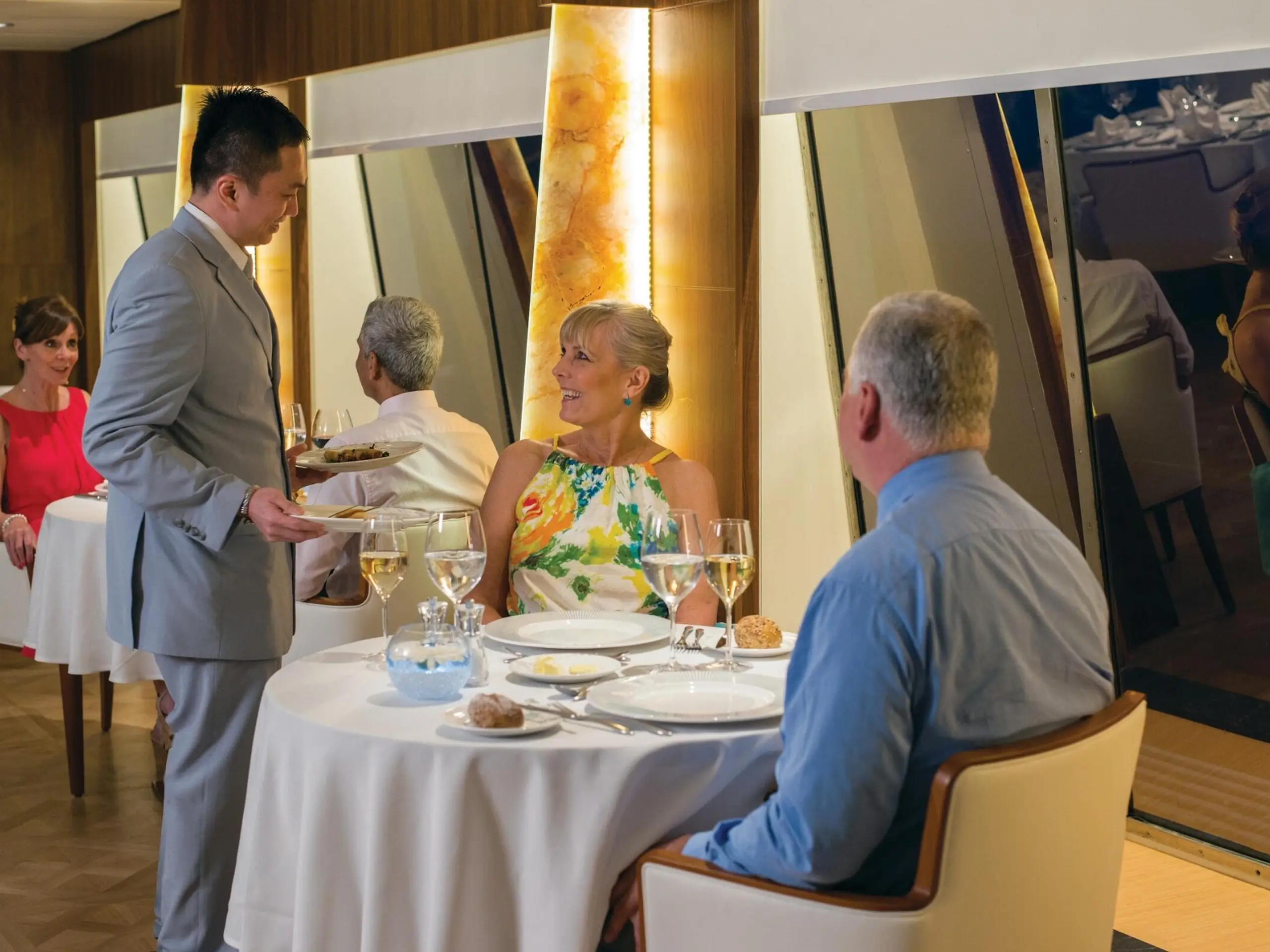 Couple enjoying the fine dining onboard Fred. Olsen